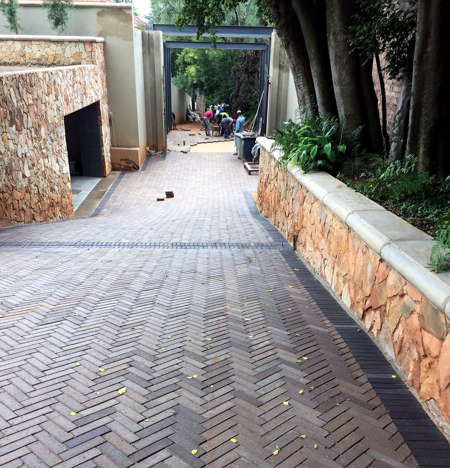 Architectural paving — herringbone brick entrance driveway