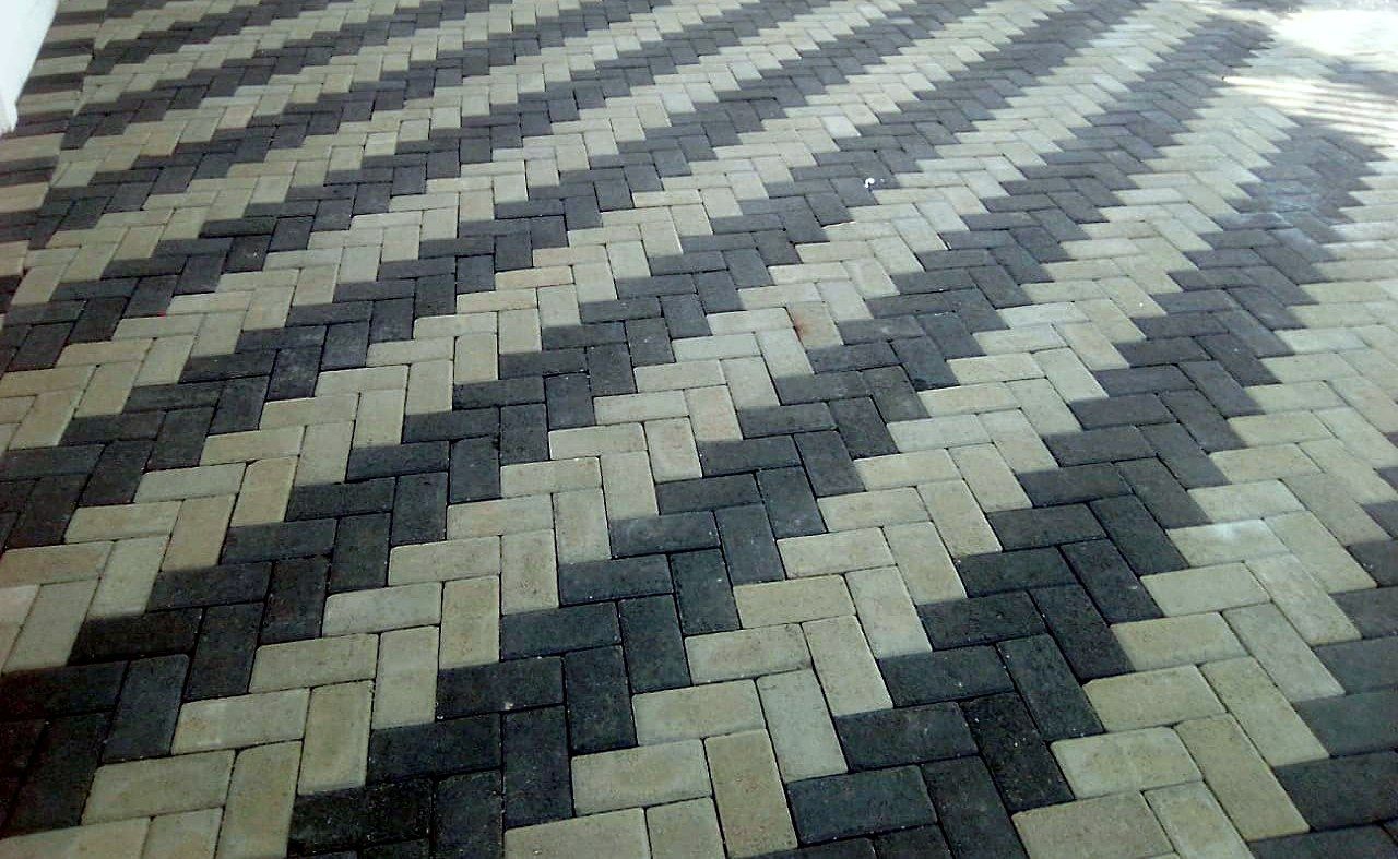Decorative two-tone bevel paving detail in a contrasting herringbone pattern